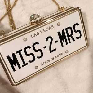Aldo “Miss-2-Mrs” License Plate Clutch